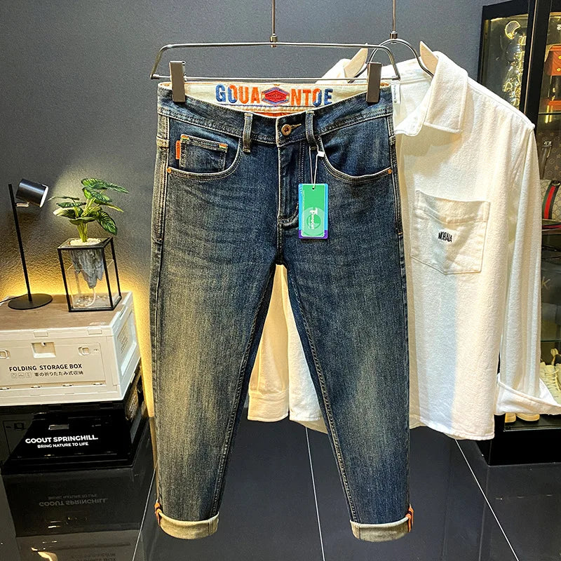 MXKSKV Men’s Slim Fit Straight-Leg Jeans. Distressed Stonewashed Denim with Badge Detail