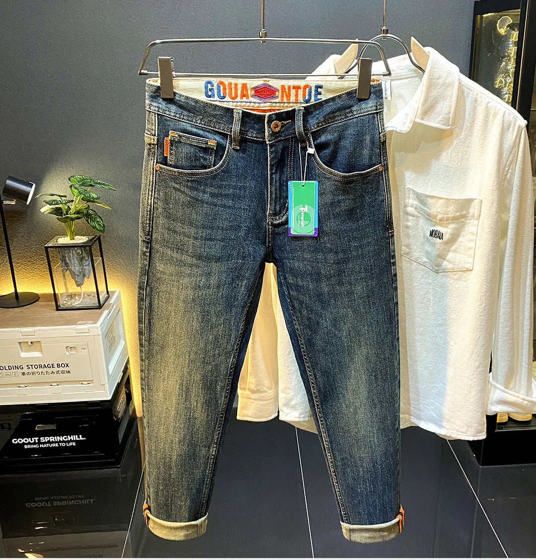 MXKSKV Men’s Slim Fit Straight-Leg Jeans. Distressed Stonewashed Denim with Badge Detail