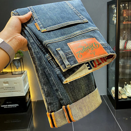 MXKSKV Men’s Slim Fit Straight-Leg Jeans. Distressed Stonewashed Denim with Badge Detail