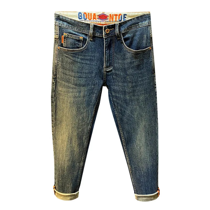 MXKSKV Men’s Slim Fit Straight-Leg Jeans. Distressed Stonewashed Denim with Badge Detail